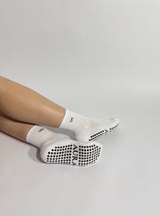 Close up 777 Pilates grip socks with AURA logo showing premium design