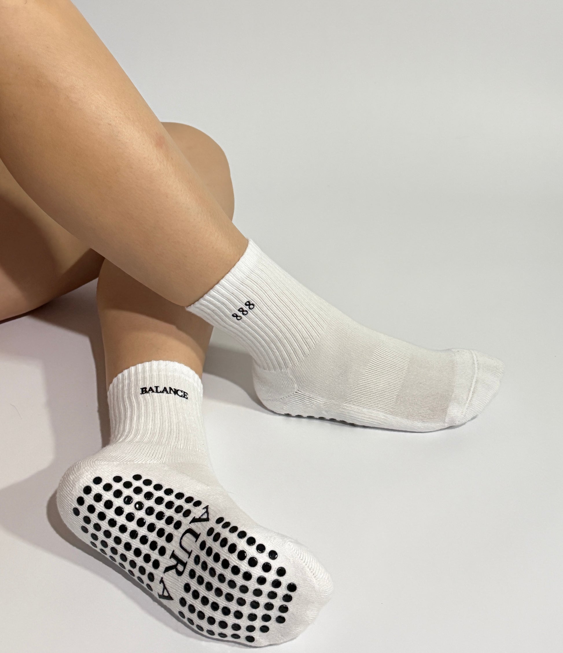 888 white Pilates grip socks with AURA non-slip design 