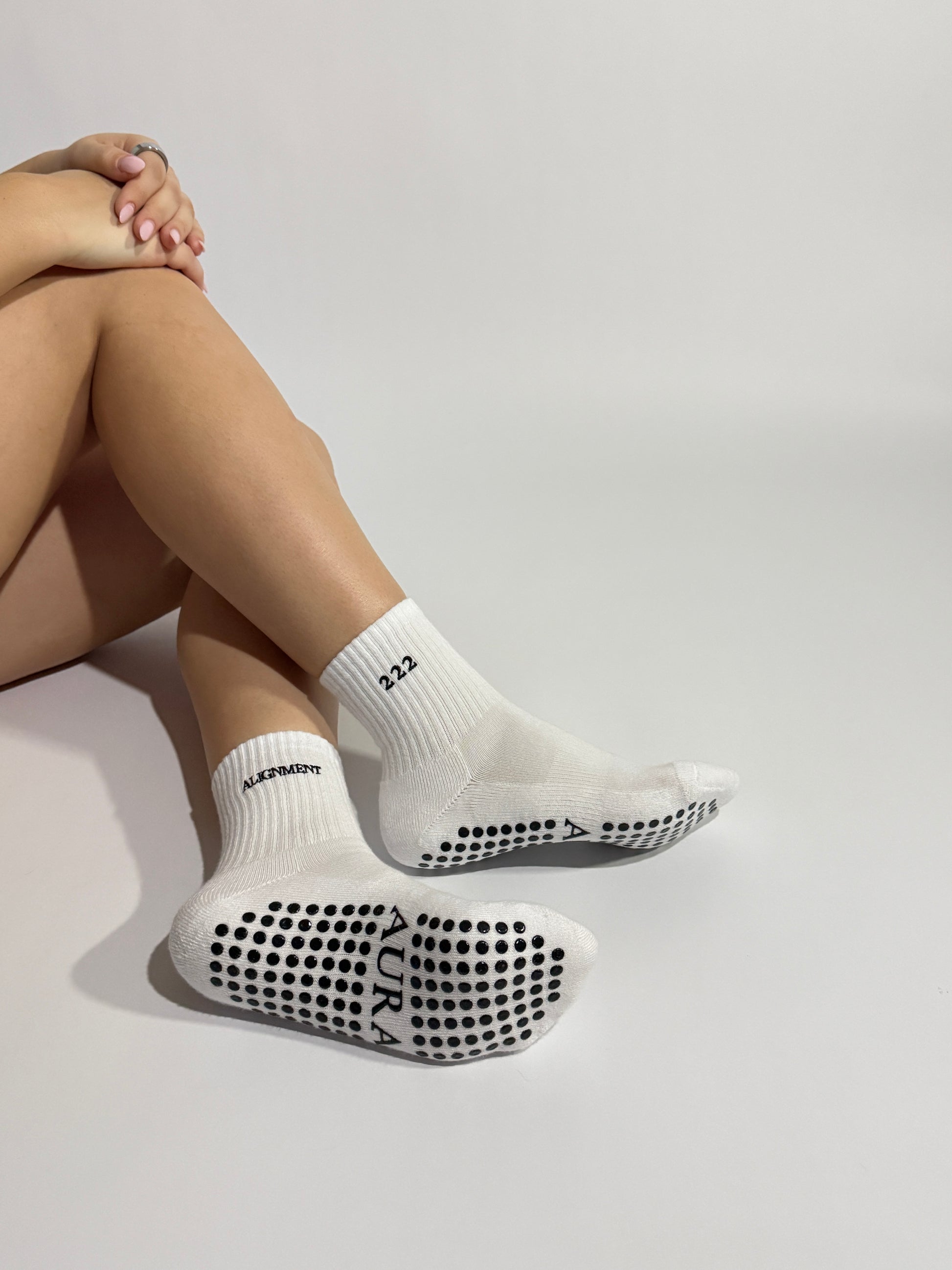 Close up on white 222 angels number Pilates grip socks showing the premium quality