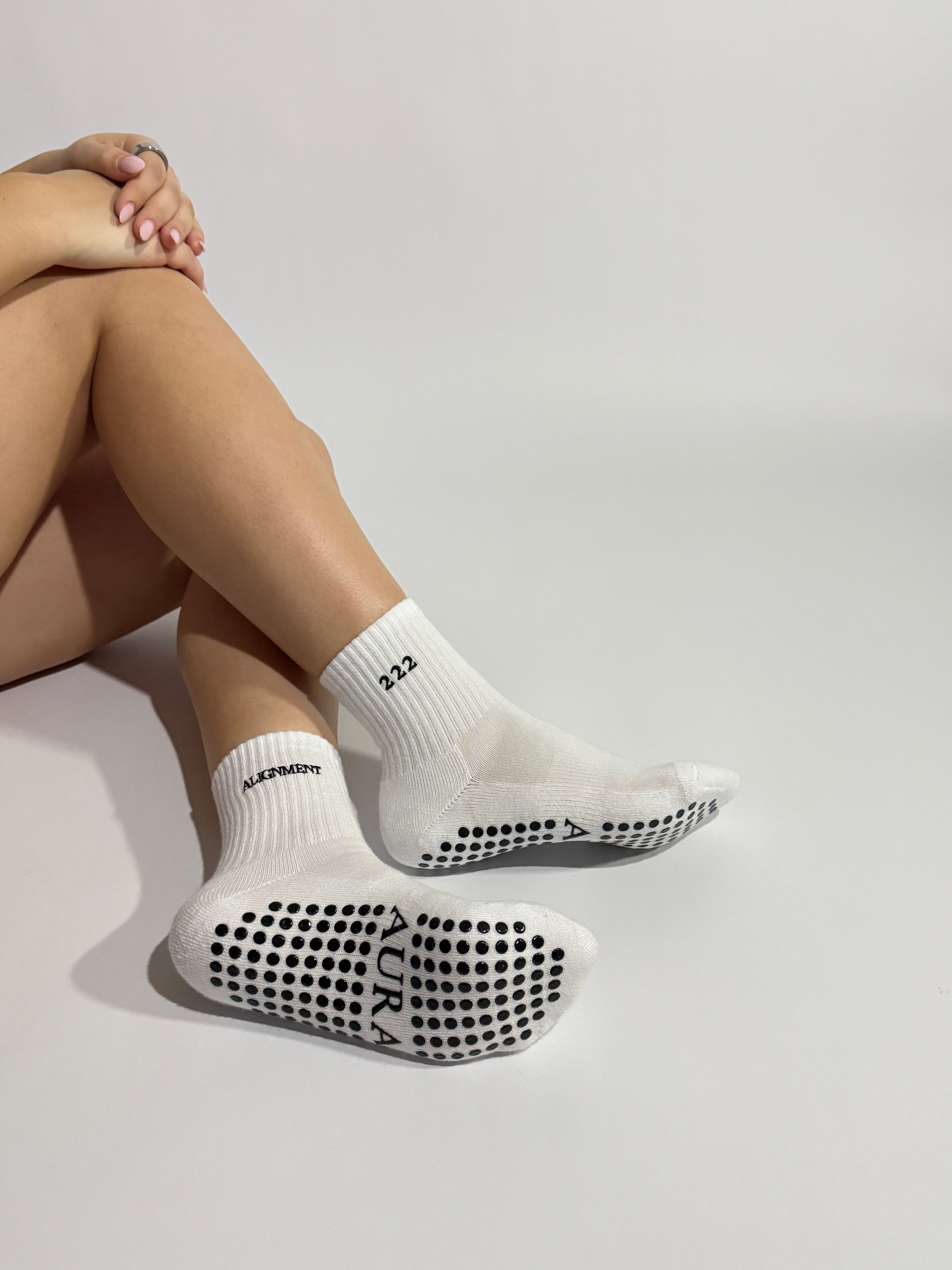 Close up on white 222 angels number Pilates grip socks showing the premium quality